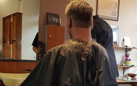 back of man in barber's chair